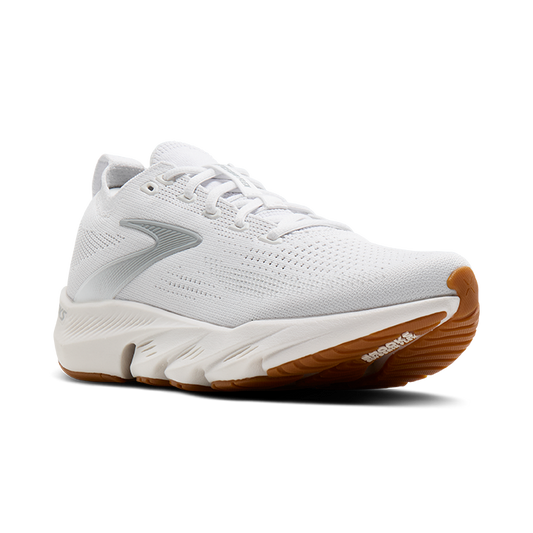 White athletic shoe with brown sole on a white background