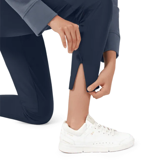 Model demonstrating zipper on side of lightweight pants