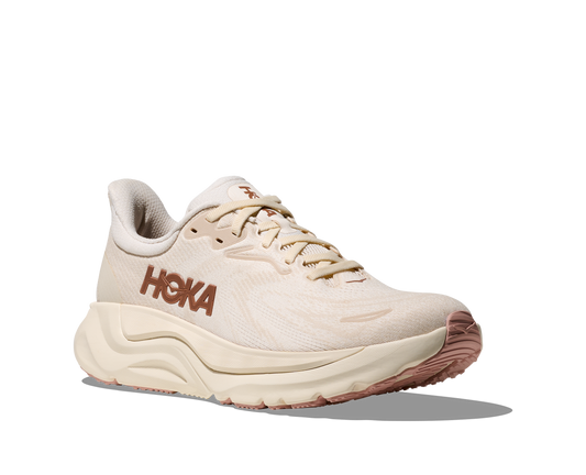 Beige running shoe with 'Hoka' branding on a white background