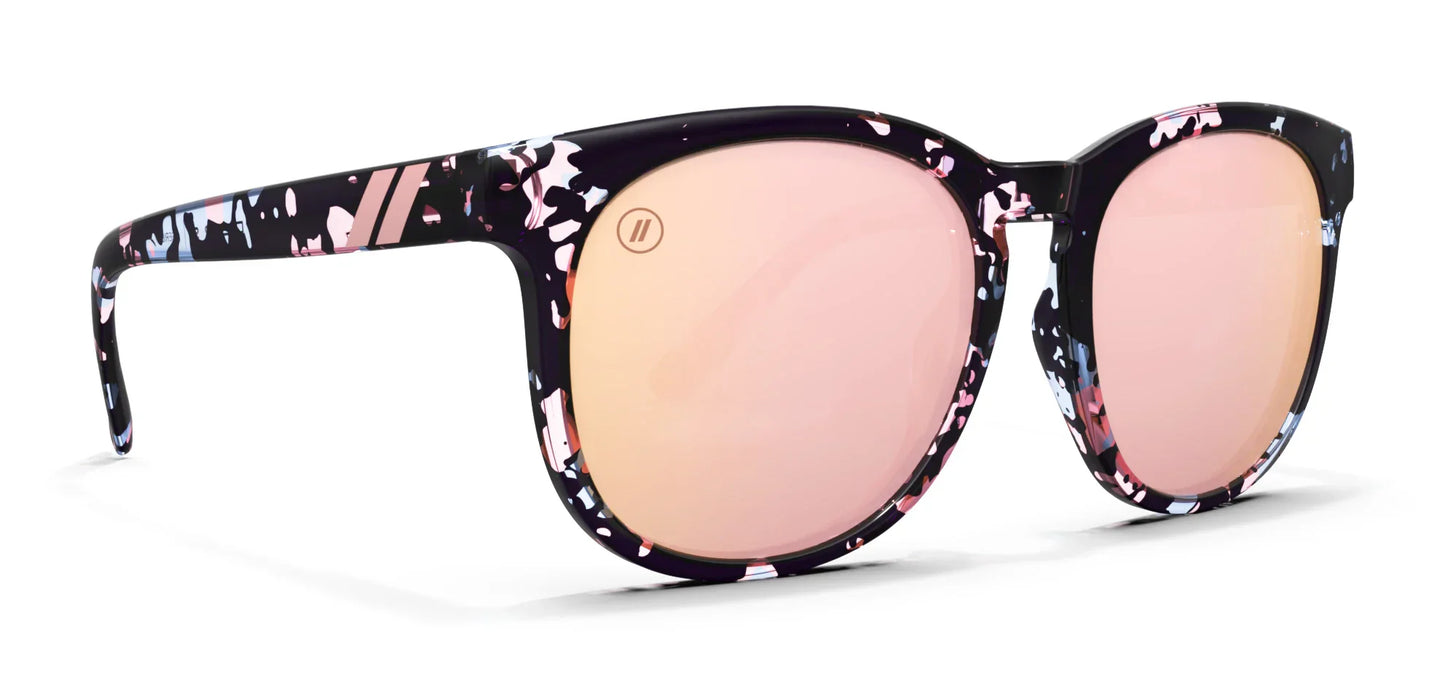 Blenders Sunglasses with floral patterned frame and pink lenses on a white background