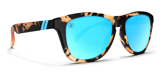 Sunglasses with tortoiseshell frame and blue lenses on a white background
